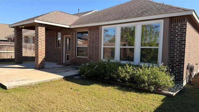 a view of a house with potted plants
