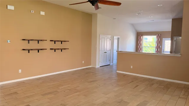 an empty room with windows and closet