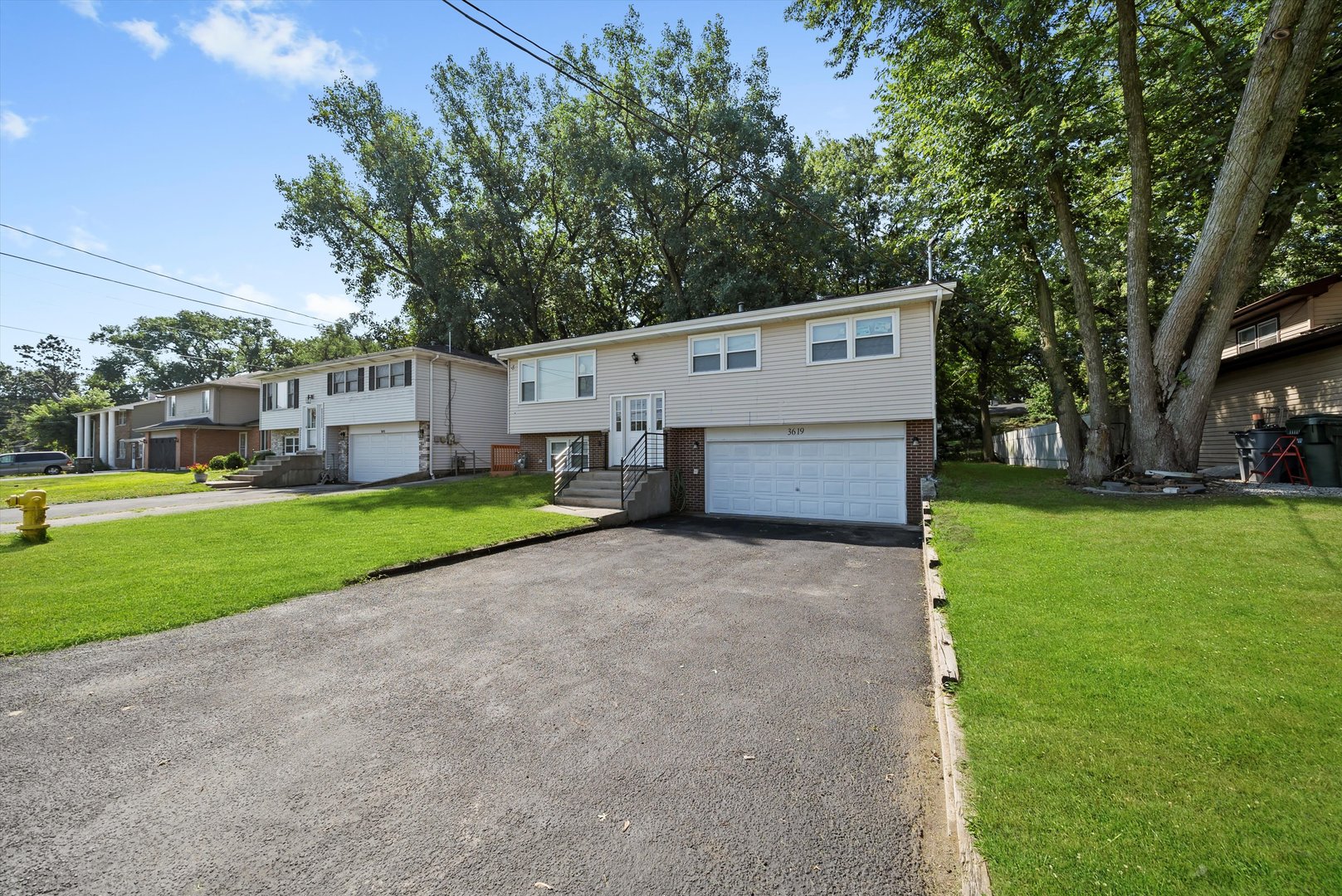 3619 West 163rd Street Markham, IL 60428 - Photo 30 of 40 a view of a house with a big yard and large tree