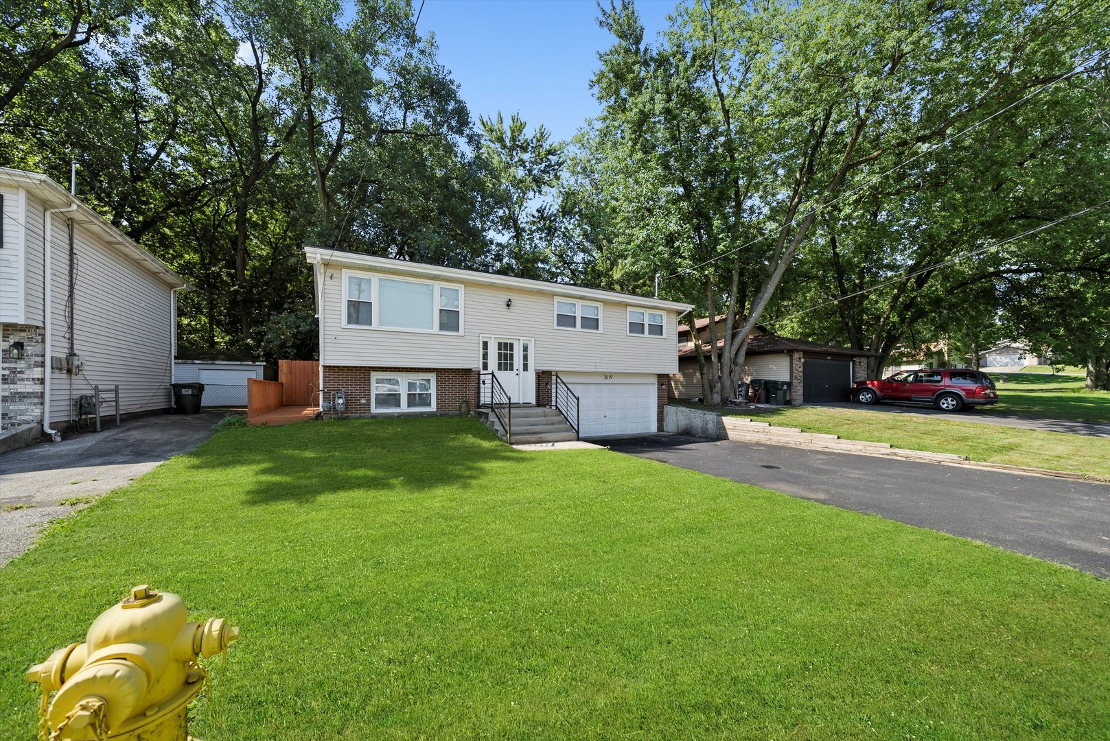 3619 West 163rd Street Markham, IL 60428 - Photo 31 of 40 a view of a house with backyard and a tree
