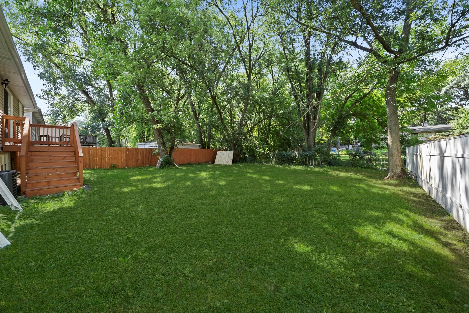 3619 West 163rd Street Markham, IL 60428 - Photo 34 of 40 a view of a backyard with a garden and trees