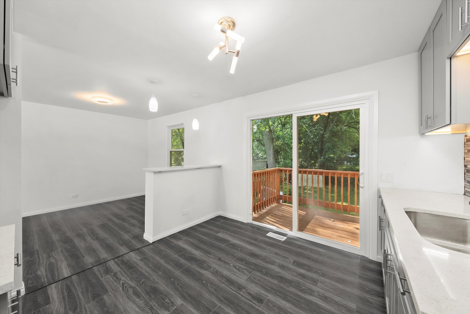3619 West 163rd Street Markham, IL 60428 - Photo 4 of 40 a view of a room with wooden floor and a ceiling fan