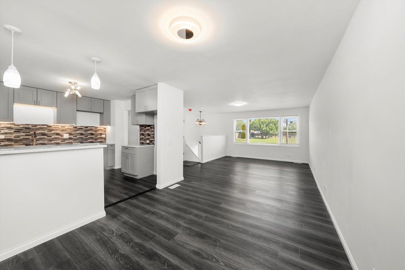 3619 West 163rd Street Markham, IL 60428 - Photo 8 of 40 a view of an empty room and a kitchen