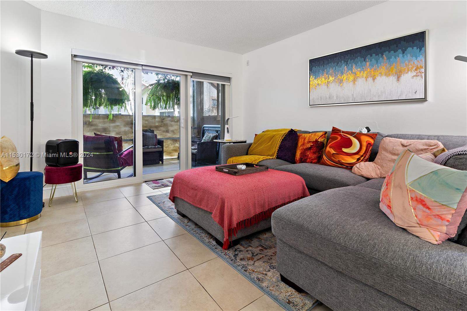 9201 Southwest 138th Place, Unit 9201 Miami, FL 33186 - Photo 7 of 20 a spacious bedroom with a bed and glass walk in closet