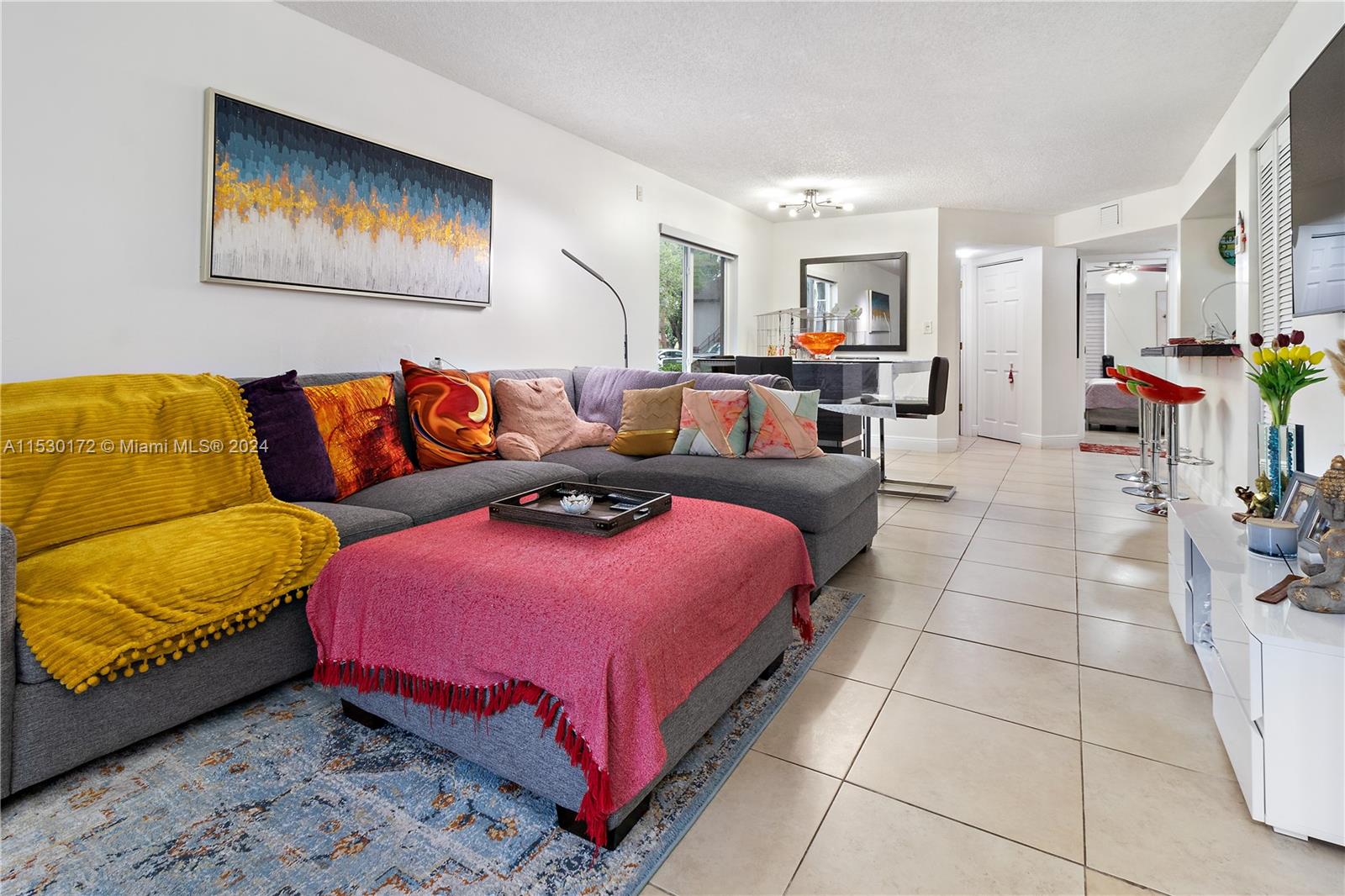 9201 Southwest 138th Place, Unit 9201 Miami, FL 33186 - Photo 9 of 20 a living room with furniture and a couch