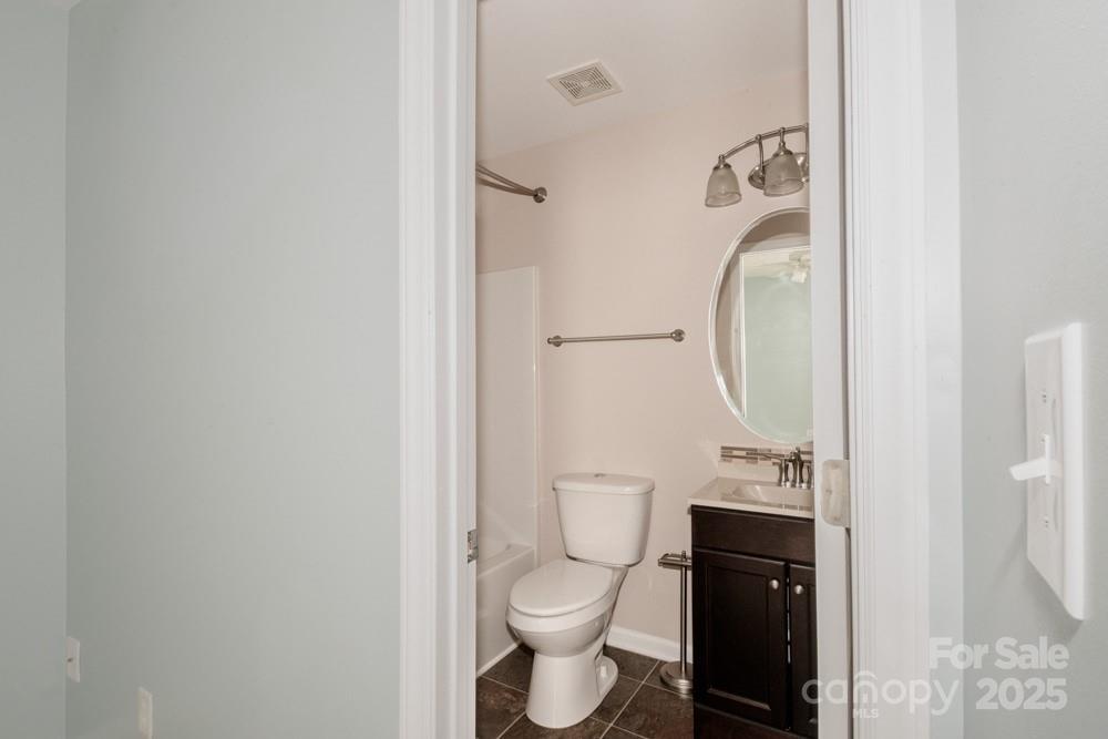5622 Osprey Cove Drive Raleigh, NC 27604 - Photo 24 of 30 a bathroom with a toilet and a sink