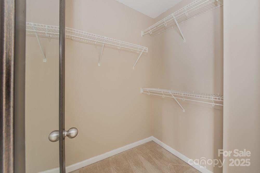 5622 Osprey Cove Drive Raleigh, NC 27604 - Photo 25 of 30 a view of a room with rack on the wall