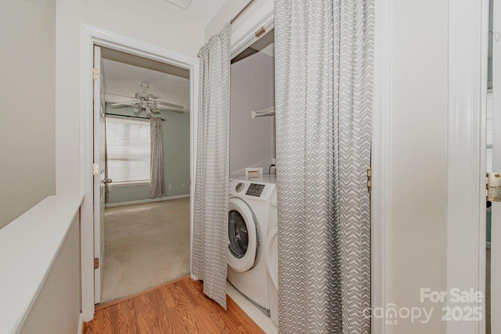 5622 Osprey Cove Drive Raleigh, NC 27604 - Photo 26 of 30 a bathroom with a washer and dryer