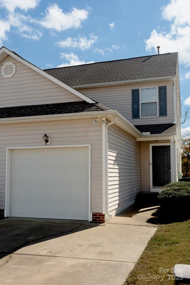 5622 Osprey Cove Drive Raleigh, NC 27604 - Photo 3 of 30 a side view of a house with a garage