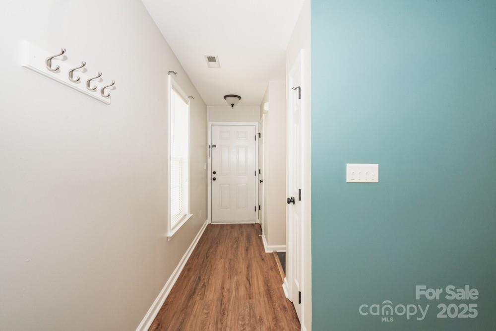 5622 Osprey Cove Drive Raleigh, NC 27604 - Photo 9 of 30 a view of a hallway with wooden floor