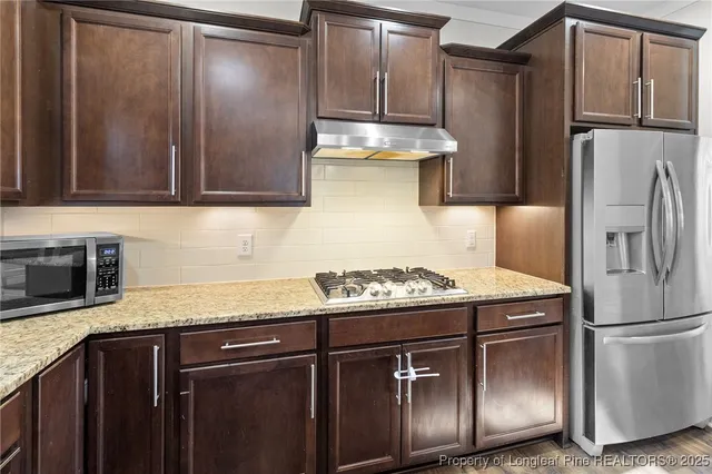 a bed room with a bed and a ceiling fan