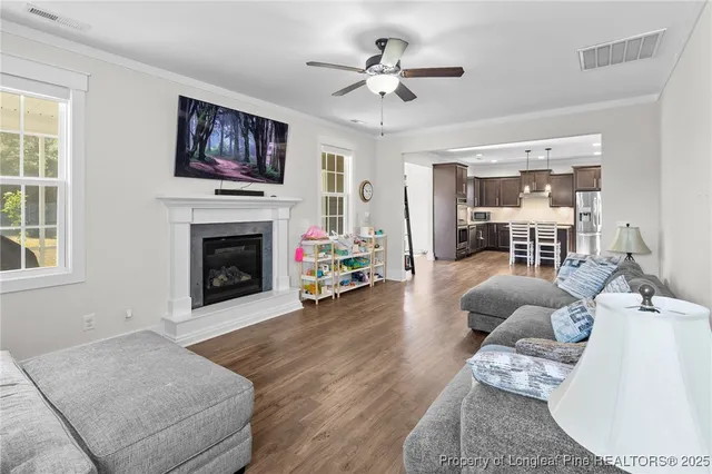 a bedroom with a bed and a ceiling fan