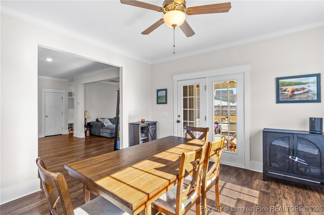 1423 Creekwood Road Hope Mills, NC 28348 - Photo 21 of 49 a view of a dining room with furniture and wooden floor