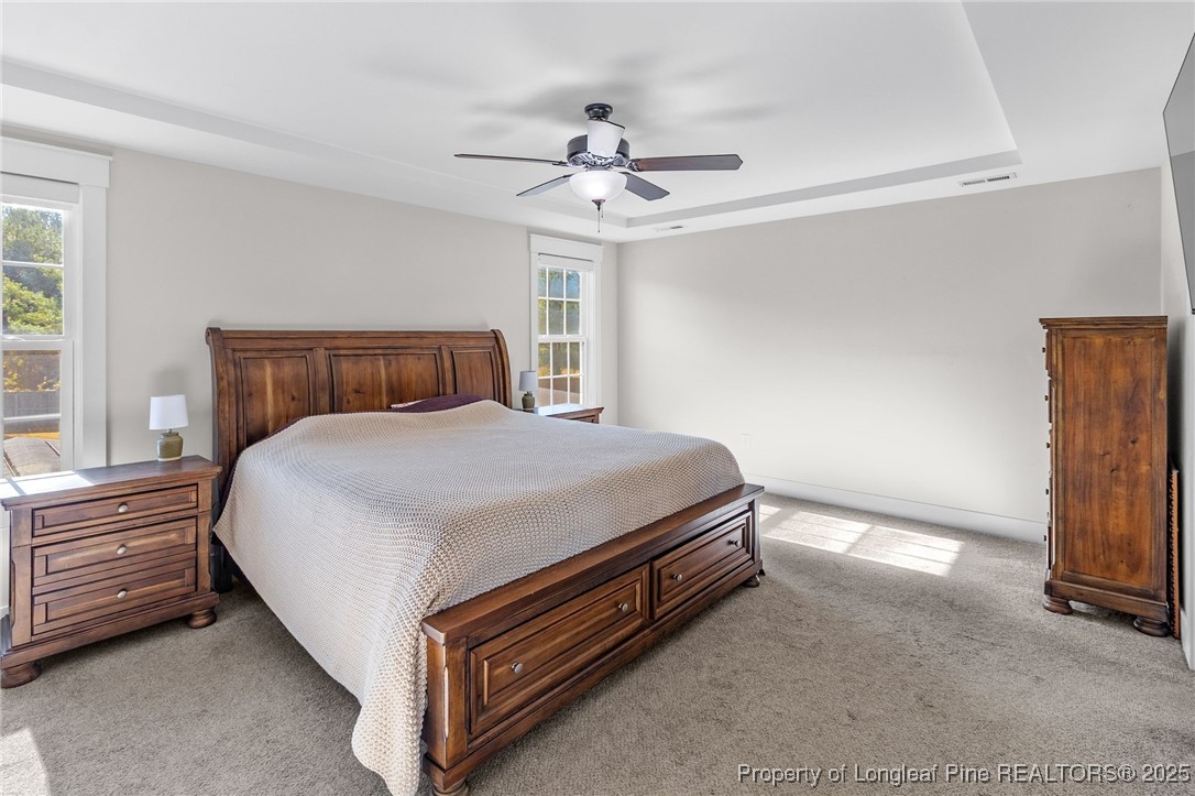 1423 Creekwood Road Hope Mills, NC 28348 - Photo 24 of 49 a bed room with a bed and a ceiling fan