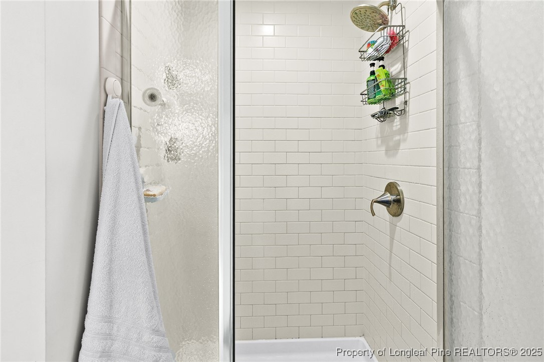 1423 Creekwood Road Hope Mills, NC 28348 - Photo 27 of 49 a bathroom with a shower