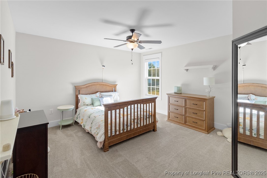 1423 Creekwood Road Hope Mills, NC 28348 - Photo 37 of 49 a bedroom with furniture and window