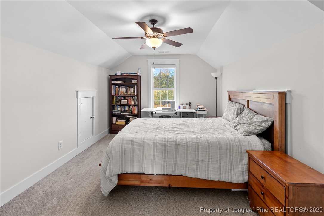 1423 Creekwood Road Hope Mills, NC 28348 - Photo 42 of 49 a bedroom with a bed and a ceiling fan