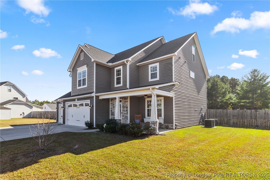 1423 Creekwood Road Hope Mills, NC 28348 - Photo 6 of 49 a front view of a house with a yard