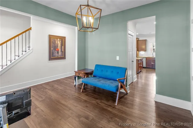 a living room with furniture fireplace and flat screen tv