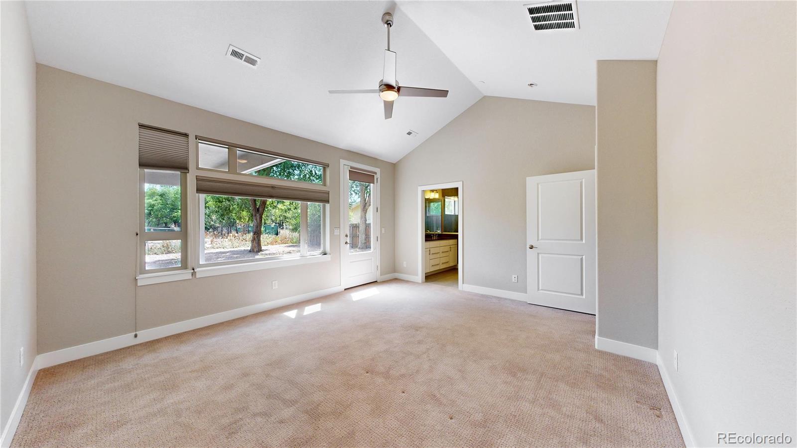 6027 Indian Road Boulder, CO 80301 - Photo 18 of 39 an empty room with windows and outdoor view