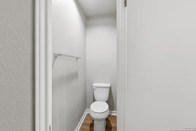 a view of a house with a backyard and a tree