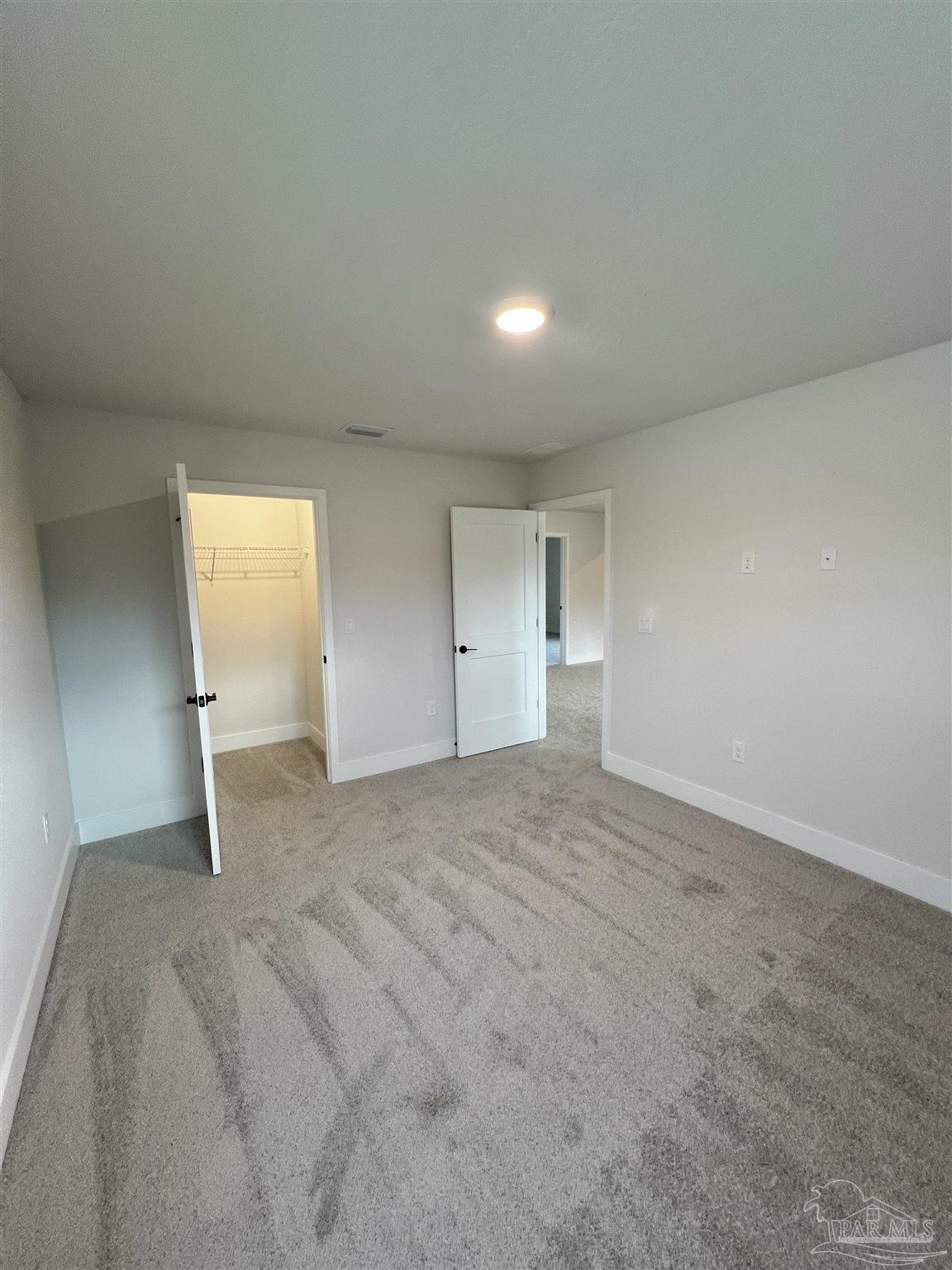 940 Rustling Pnes Road, Unit 13B Cantonment, FL 32533 - Photo 10 of 14 a view of room and window