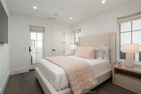 a bedroom with a bed and a night stand