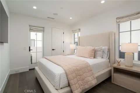 a bedroom with a bed and a night stand