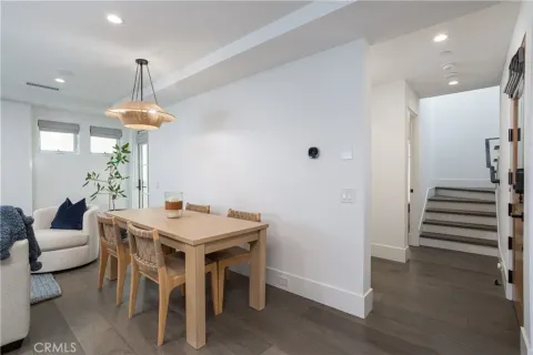 a living room with furniture a table and a chandelier