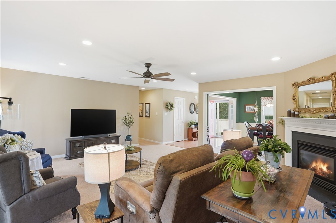 19012 Teman Road Beaverdam, VA 23015 - Photo 4 of 41 a living room with furniture a fireplace and a flat screen tv