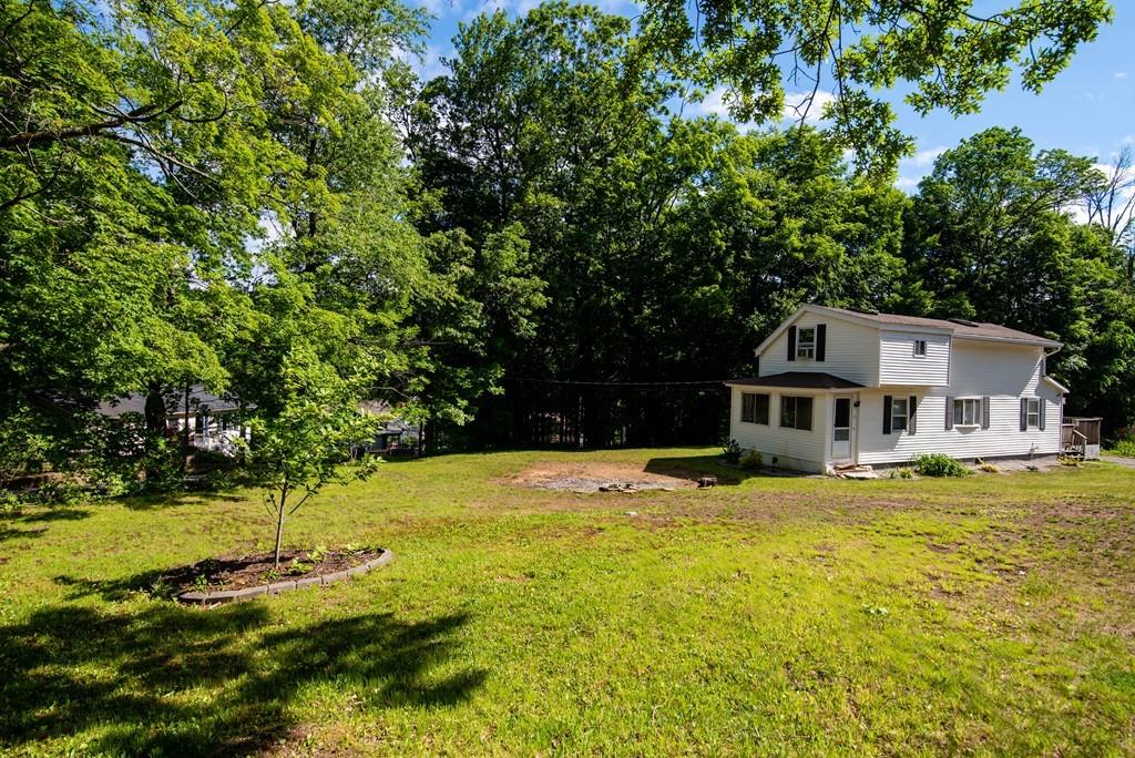 a house view with a swimming pool in front of house