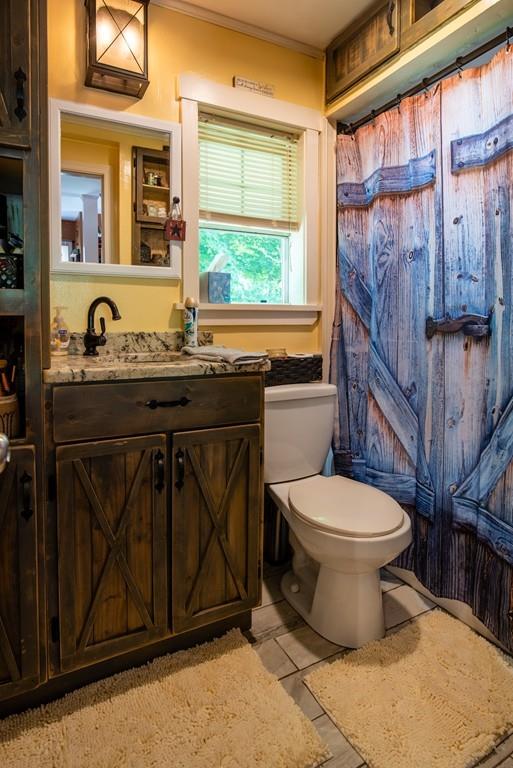 2 Chestnut Street Leicester, MA 01611 - Photo 13 of 30 a bathroom with a toilet a sink and a shower
