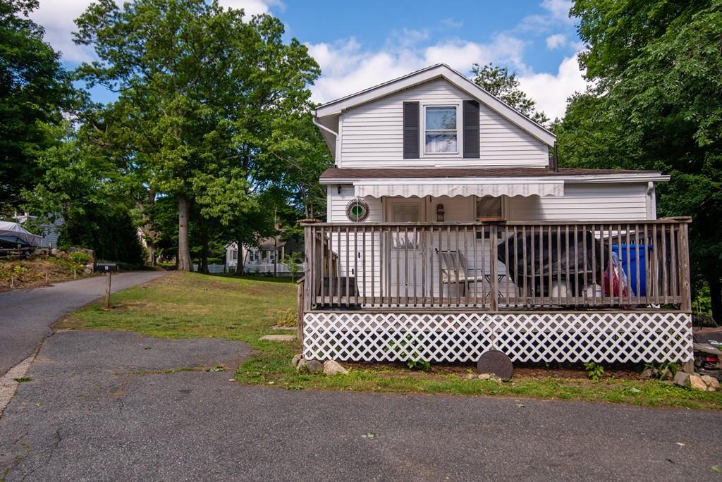 2 Chestnut Street Leicester, MA 01611 - Photo 2 of 30 a view of a wooden house and a yard and trees