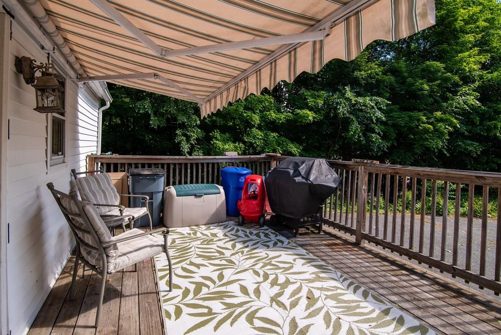 2 Chestnut Street Leicester, MA 01611 - Photo 6 of 30 a view of balcony with wooden floor and outdoor seating