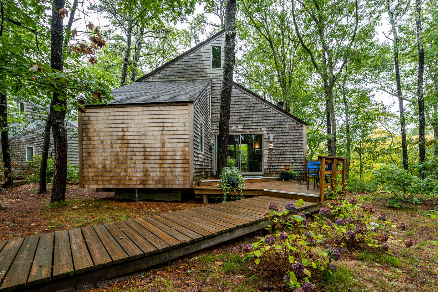 1780 Route 6, Unit B3 Wellfleet, MA 02667 - Photo 1 of 22 a view of a two chairs in the deck