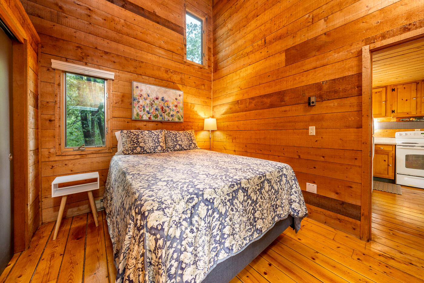 1780 Route 6, Unit B3 Wellfleet, MA 02667 - Photo 15 of 22 a bedroom with a bed and wooden floor