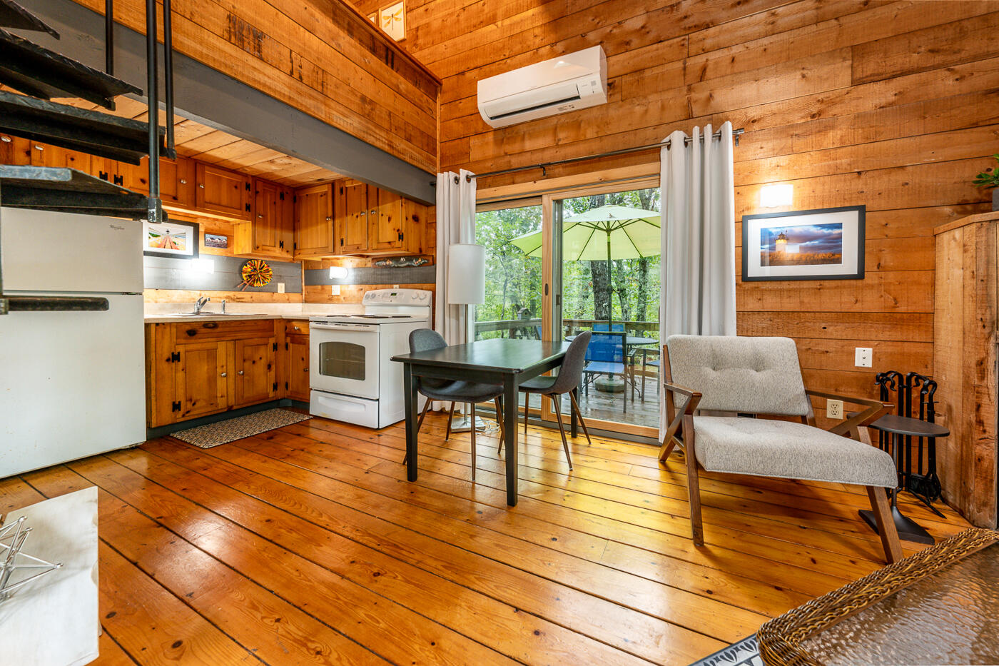 1780 Route 6, Unit B3 Wellfleet, MA 02667 - Photo 10 of 22 a view of a patio with dining table and chairs