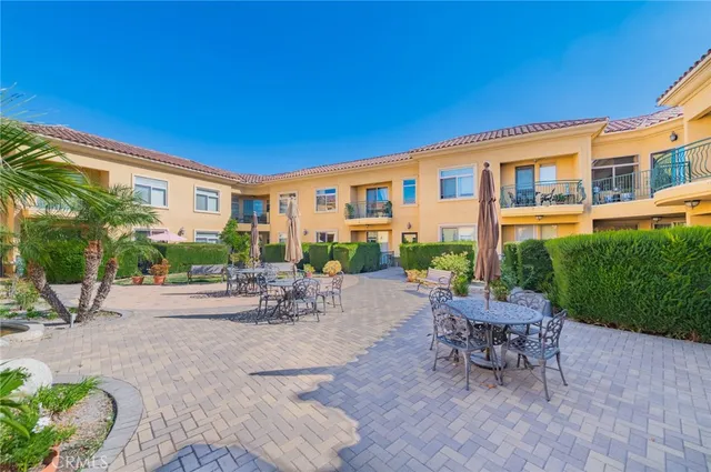 a living room with furniture a window and gym equipment