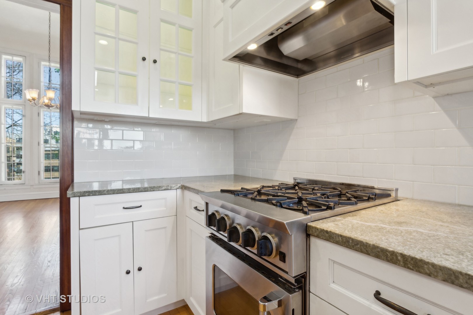 482 Sheridan Road, Unit 3 Evanston, IL 60202 - Photo 17 of 39 a kitchen with granite countertop stainless steel appliances a stove microwave and cabinets