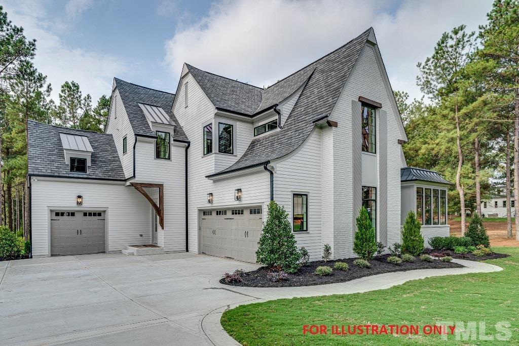 1317 Westfield Avenue Raleigh, NC 27607 - Photo 26 of 29 a front view of a house with a yard and garage