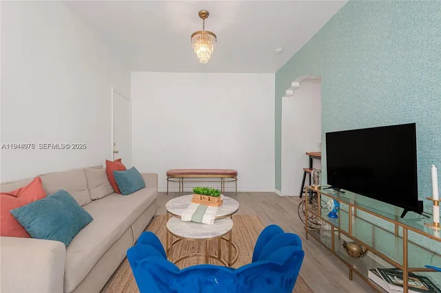 a living room with furniture and a flat screen tv