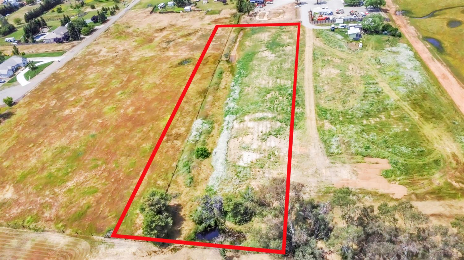 6701 Grant Line Road Sloughhouse, CA 95683 - Photo 11 of 31 a street view with large tree