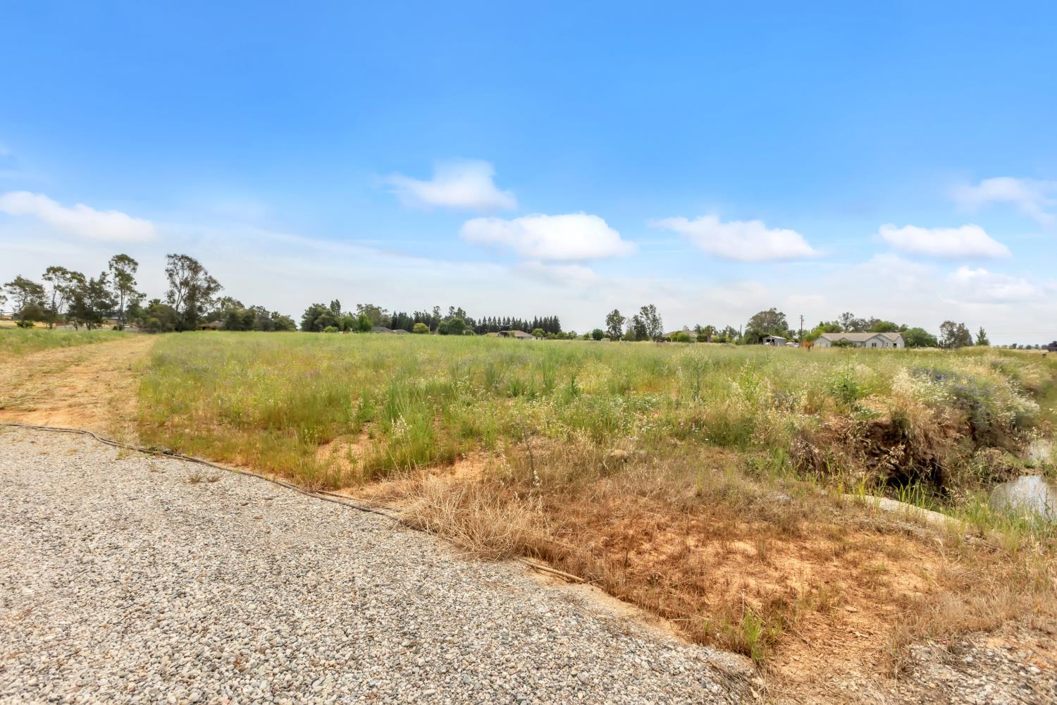 6701 Grant Line Road Sloughhouse, CA 95683 - Photo 25 of 31 a view of a lake with houses in the back