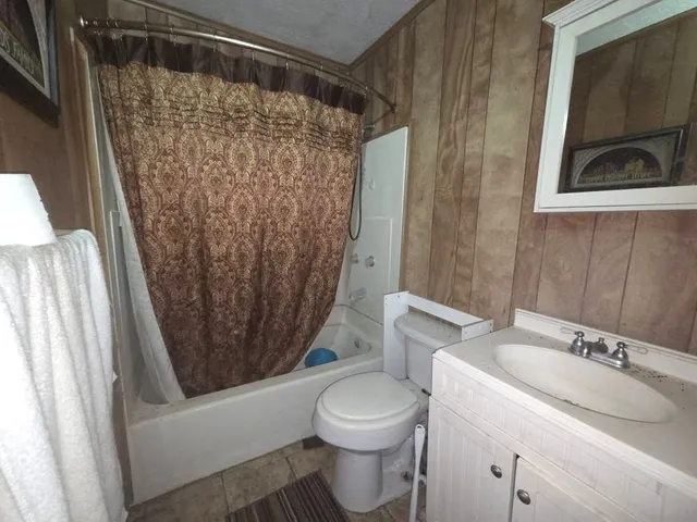 a spacious bathroom with a shower and a sink