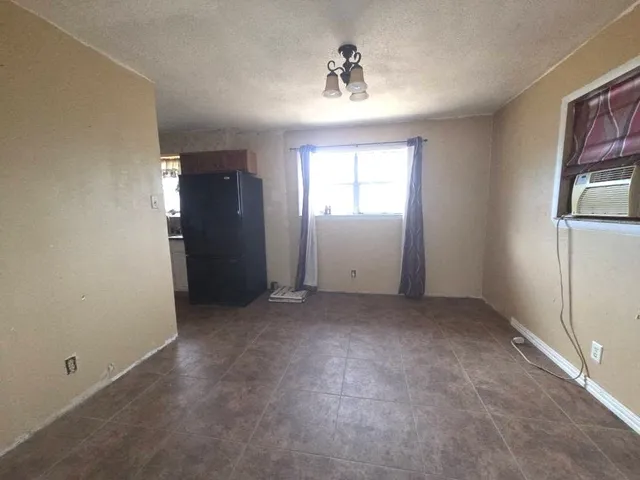 a kitchen with stainless steel appliances a sink stove and cabinets