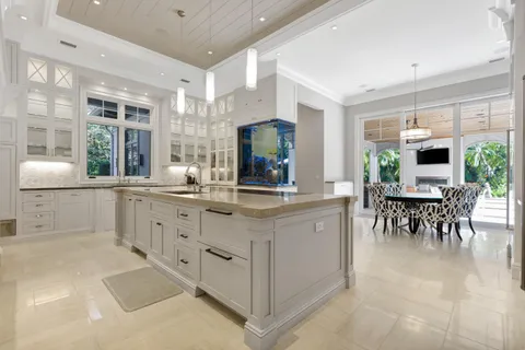 a spacious bathroom with a granite countertop sink toilet a mirror and shower