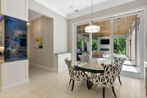a bathroom with a granite countertop toilet a sink a mirror and a shower