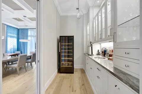 a view of a backyard with swimming pool