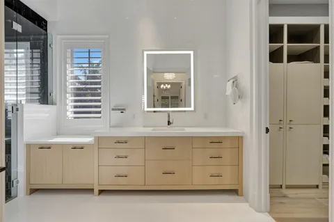 a dining room with furniture window and wooden floor