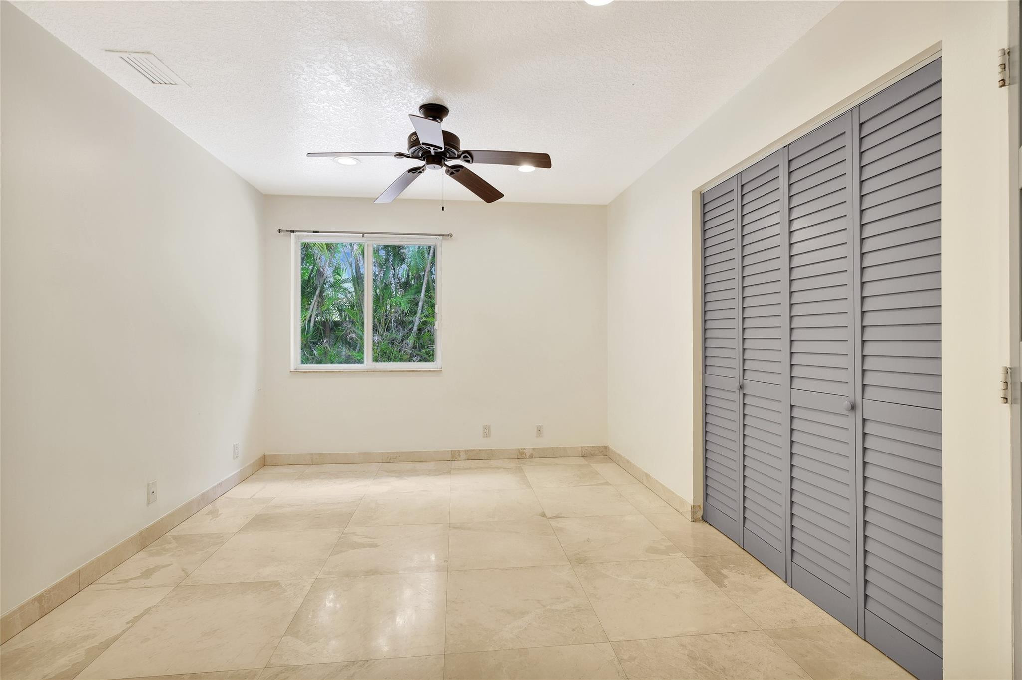 1515 Garden Road Weston, FL 33326 - Photo 21 of 55 Large Guest Bedroom with Fan